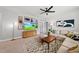 Relaxing living area has sectional seating, neutral color scheme, TV and stylish accents at 6036 Balance Ct, Raleigh, NC 27616