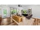 Cozy living room with hardwood floors, a ceiling fan, and comfortable seating arrangement at 6036 Balance Ct, Raleigh, NC 27616