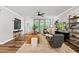 Inviting living room with plush seating, a stylish ceiling fan, and hardwood floors at 6036 Balance Ct, Raleigh, NC 27616