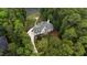 Overhead view of a gorgeous two-story home with a long driveway through lush greenery at 636 Pendleton Lake Rd, Raleigh, NC 27614
