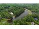 Panoramic aerial view of a home by the lake surrounded by lush greenery at 636 Pendleton Lake Rd, Raleigh, NC 27614