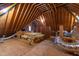 Spacious attic with exposed wooden beams, providing potential for versatile storage or conversion opportunities at 636 Pendleton Lake Rd, Raleigh, NC 27614