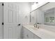 Bathroom featuring a door and a wide mirror at 636 Pendleton Lake Rd, Raleigh, NC 27614