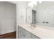 Elegant bathroom featuring a well-lit mirror and vanity with ample counter space and storage, blending style and functionality at 636 Pendleton Lake Rd, Raleigh, NC 27614