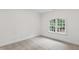 Bedroom with neutral carpet and a window with leafy view at 636 Pendleton Lake Rd, Raleigh, NC 27614