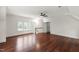 Spacious bonus room features hardwood floors, large windows, and ceiling fan at 636 Pendleton Lake Rd, Raleigh, NC 27614