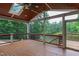 Inviting covered deck features a ceiling fan and views of the lake, enhancing outdoor living and relaxation at 636 Pendleton Lake Rd, Raleigh, NC 27614