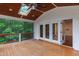 Relaxing covered deck with wooded views, perfect for enjoying nature and outdoor living at 636 Pendleton Lake Rd, Raleigh, NC 27614