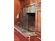 Close-up of a decorative fireplace with a metal screen and ornate wood trim at 636 Pendleton Lake Rd, Raleigh, NC 27614