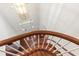 Elegant foyer showcasing a grand staircase with wood banister and bright chandelier lighting at 636 Pendleton Lake Rd, Raleigh, NC 27614