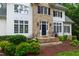 Close up of the stone facade and main entrance to the home at 636 Pendleton Lake Rd, Raleigh, NC 27614