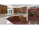 This kitchen showcases wood cabinets, granite countertops, stainless appliances, and hardwood floors at 636 Pendleton Lake Rd, Raleigh, NC 27614