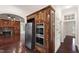 Kitchen boasts built-in stainless oven and refrigerator, complemented by stylish wood cabinetry and hardwood floors at 636 Pendleton Lake Rd, Raleigh, NC 27614