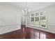 Elegant living room with beautiful trim and large windows offering plenty of natural light at 636 Pendleton Lake Rd, Raleigh, NC 27614