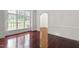 Elegant living room with beautiful trim and large windows at 636 Pendleton Lake Rd, Raleigh, NC 27614