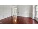Elegant living room with beautiful trim and glass french doors at 636 Pendleton Lake Rd, Raleigh, NC 27614