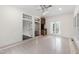Beautiful sunroom featuring a wet bar, tile floors, and abundant natural light from large windows at 636 Pendleton Lake Rd, Raleigh, NC 27614