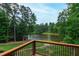 Scenic view of a serene lake surrounded by lush greenery, offering a tranquil and picturesque backdrop at 636 Pendleton Lake Rd, Raleigh, NC 27614