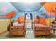 Themed bedroom with twin beds, custom painted walls and whimsical decorative elements at 6617 Whitted Rd, Fuquay Varina, NC 27526
