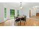 Dining room featuring wood floor, a chandelier, and a view at 6617 Whitted Rd, Fuquay Varina, NC 27526