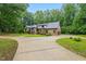 Beautifully landscaped home with circular driveway and Tudor style architecture at 6617 Whitted Rd, Fuquay Varina, NC 27526