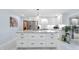 Spacious kitchen island featuring white cabinets, granite countertops, and modern appliances at 6617 Whitted Rd, Fuquay Varina, NC 27526