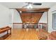 Spacious living area showcasing vaulted wood ceilings, hardwood floors, and bright natural light at 6617 Whitted Rd, Fuquay Varina, NC 27526
