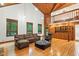 Spacious living room with wooden floors, high ceilings, and an open layout with built-in shelving at 6617 Whitted Rd, Fuquay Varina, NC 27526