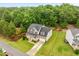 Lovely home with inviting front porch, stone accents, and a well-manicured lawn at 6949 Rex Rd, Holly Springs, NC 27540