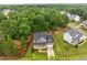 Picturesque aerial view showcasing the home nestled in a lush, wooded neighborhood at 6949 Rex Rd, Holly Springs, NC 27540
