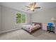 Bedroom featuring a ceiling fan, window, and a desk at 6949 Rex Rd, Holly Springs, NC 27540