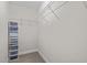 Walk-in closet with shelves and carpeted floor at 6949 Rex Rd, Holly Springs, NC 27540