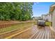 Large wooden deck area with a grill, offering ample space for outdoor entertaining and relaxation at 6949 Rex Rd, Holly Springs, NC 27540