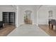 Open foyer with arched doorways, connecting the living spaces and providing a glimpse into the home's design at 6949 Rex Rd, Holly Springs, NC 27540