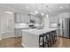 Well-equipped kitchen with large island, stainless steel appliances, and ample storage at 6949 Rex Rd, Holly Springs, NC 27540
