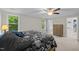 Spacious main bedroom featuring windows, a dresser, and an ensuite bathroom and walk-in closet at 6949 Rex Rd, Holly Springs, NC 27540