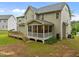 Charming home features a spacious deck and screened porch for enjoying the outdoors at 6949 Rex Rd, Holly Springs, NC 27540