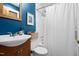 Beautiful bathroom with blue walls, shower and white tile at 729 Mial St, Raleigh, NC 27608