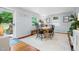 Well-lit dining room featuring hardwood floors, stylish decor, and lots of natural light at 729 Mial St, Raleigh, NC 27608