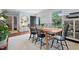 Inviting dining room features a modern table with six chairs and ample natural light at 729 Mial St, Raleigh, NC 27608