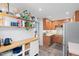 Bright kitchen with open shelving, stainless steel appliances, and light wood cabinetry at 729 Mial St, Raleigh, NC 27608