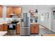 Updated kitchen featuring stainless steel appliances, wood cabinetry, and an open layout at 729 Mial St, Raleigh, NC 27608