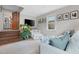 Bright living room with hardwood floors, large windows and comfortable seating at 729 Mial St, Raleigh, NC 27608