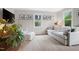 Inviting living room featuring neutral colors, ample natural light, and stylish decor at 729 Mial St, Raleigh, NC 27608
