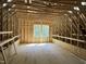 Unfinished attic space with exposed wood beams and natural light at 79 Oldham Estate Dr, Chapel Hill, NC 27517