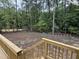The spacious backyard is surrounded by mature trees, providing a serene, private retreat at 79 Oldham Estate Dr, Chapel Hill, NC 27517