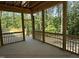 Inviting screened porch with natural light and scenic views of surrounding trees at 79 Oldham Estate Dr, Chapel Hill, NC 27517