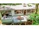 Aerial view of the large back deck with dining and seating areas, providing outdoor space with wooded views at 800 Shady Lawn Rd, Chapel Hill, NC 27514