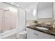Classic bathroom design, featuring shower with curtain, vanity with granite countertop, and ample lighting at 800 Shady Lawn Rd, Chapel Hill, NC 27514