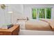 Bright bedroom with a view of a lush green landscape through a large window, creating a serene atmosphere at 800 Shady Lawn Rd, Chapel Hill, NC 27514